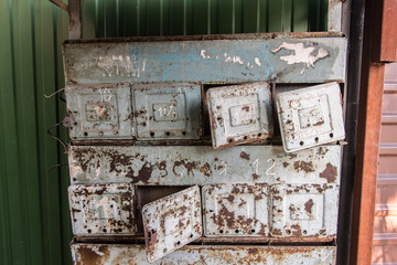 Abandoned mailboxes. Desolation and ruin. Concept. Rusty metal boxes.