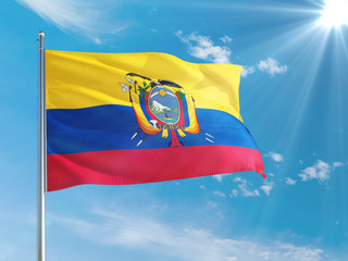 Ecuador national flag waving in the wind against deep blue sky. High quality fabric. International relations concept.