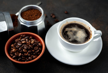Cup of coffee ,Geyser Coffee Maker, and beans on a stone background. 
coffee background