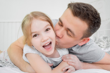 dad daughter blonde tickling and playing on bed