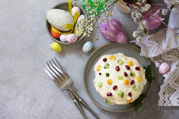 Holiday salad is not a sweet cake. Salad with rice, egg, crab sticks and cucumber on a stone or concrete on a light countertop. Top view flat lay background.