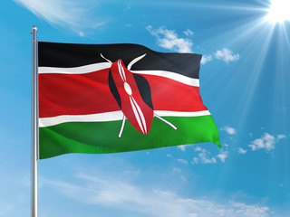 Kenya national flag waving in the wind against deep blue sky. High quality fabric. International relations concept.