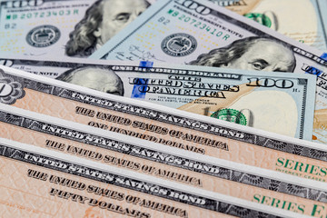 United States of America government savings bond series EE with 100 dollar bills