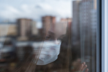 girl looks out the window