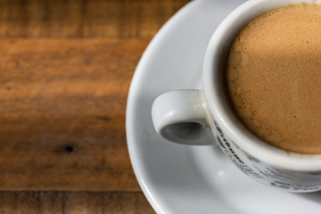 cup  of espresso on a wooden table