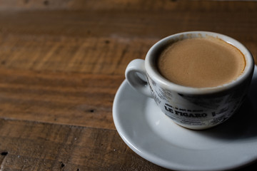 cup  of espresso on a wooden table