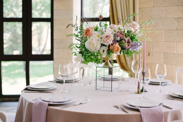 Table setting at a luxury wedding and Beautiful flowers on the table.