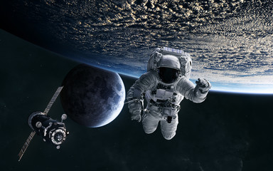 Astronaut, ISS in low Earth orbit. Moon. Solar system. Science fiction. Elements of this image...