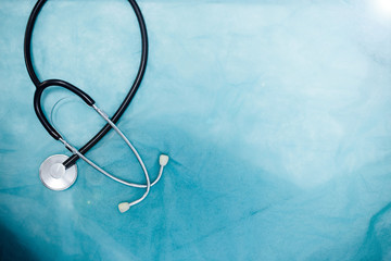 stethoscope on a blue background, medical copy-space concept.