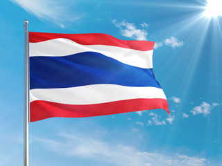 Thailand national flag waving in the wind against deep blue sky. High quality fabric. International relations concept.