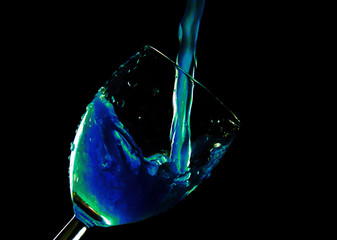 glass of liqueur on a black background