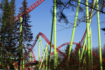 Roller coaster, carousel in an amusement park, amusement park.