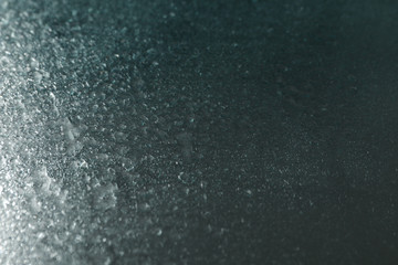 Wet mirror background with water, close up