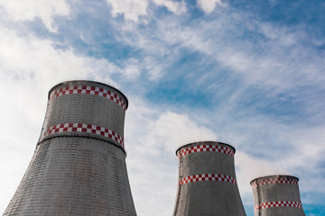 Cooling tower, desuperheater, smoke from a pipe of an industrial plant or thermal power plant on a...