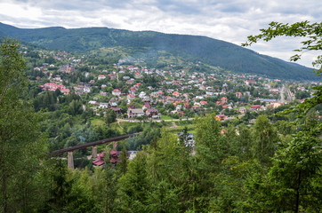 Fototapeta na wymiar Summer panoramic view of the Yaremche city resort located in the valley near the Carpathian Mountains, Ukraine
