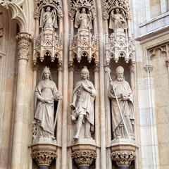 Sculptures of people on the ancient facade of the Church, Europe