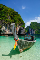 Boat in turquoise water Phi Phi island Thailand