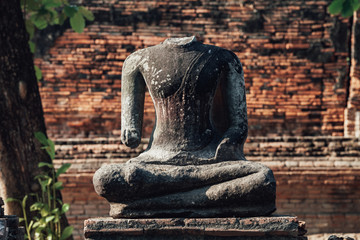 Headless Buddha statue in a monastery in Ayutthaya 