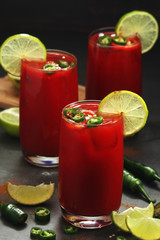 Jalapeno tomato margarita cocktail with lime