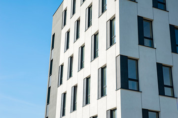 White and grey facade of modern office building
