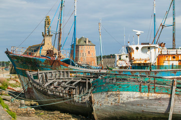 rotten fishing vessels on the beach of the pitouresk breton village of Camaret sur mer