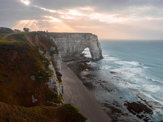 Sunrise over a cliff, cliffs and Lamanche Channel. Etretat, France