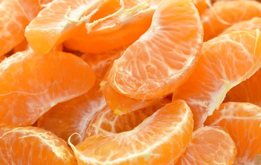 tangerine orange peel out and piece on wooden table