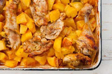 Baked potato with chicken cooked in an electric oven. Background for cooking.