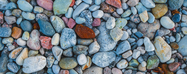 multi colored stones on the beach view from above