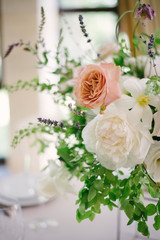 Wedding flowers, bridal decor closeup. Decoration made of peonies, roses and decorative plants