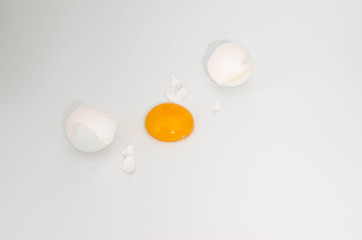 white broken egg on the table on white background