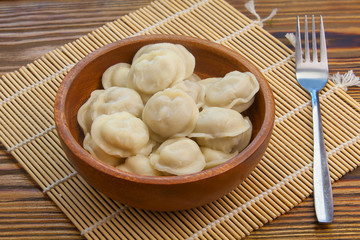 fresh hot appetizing dumplings on  plate