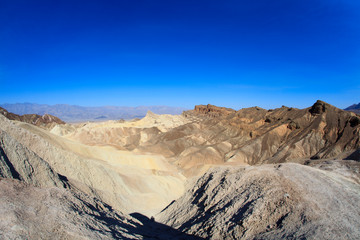Fototapeta na wymiar California / USA - August 22, 2015: The landscape and rock formations around Zabriskie point near Death Valley National Park, California, USA