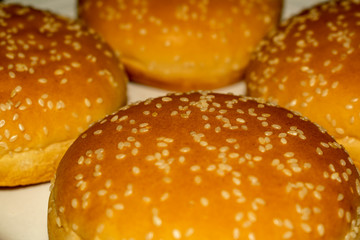 Delicious rolls for homemade natural burgers sprinkled with sesame.