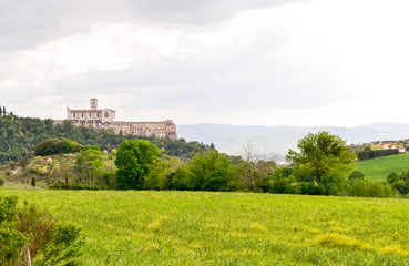The st. Francis church of Assisi seen from the walking path that lead to this little medieval town on the St. Francis way pilgrimage, a full immersion in nature, culture and history