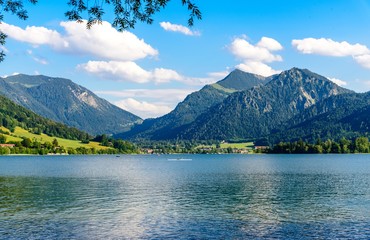 Schliersee, Bavaria, Bayern, Germany. Beautiful view on lake with alps mountains, blue sky with clouds. 