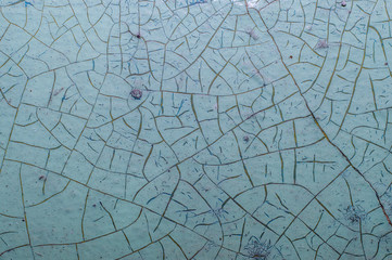 Old painted wall with cracked paint