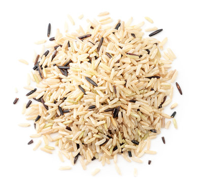 Unpolished wild rice on a white top view. Isolated