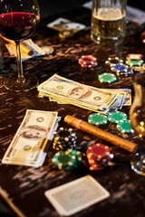 Gambling, tobacco and drinks on table
