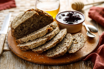 Homemade gluten free vegan buckwheat bread sprinkled with sesame seeds cut into slices,  close up