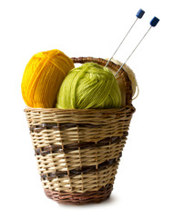 Photo illustration on knitting and needlework. The image is isolated on a white background. Yarn, knitting needles.