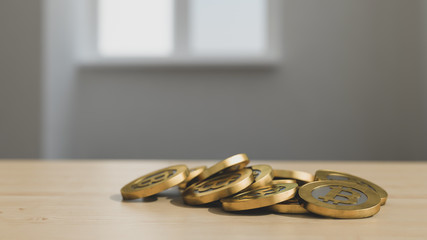 golden bitcoin coins on a wooden table