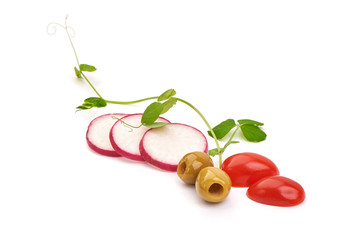 Sliced radish with cherry tomatoes and olives, isolated on white background