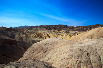 Naklejka premium California / USA - August 22, 2015: The landscape and rock formations around Zabriskie point near Death Valley National Park, California, USA