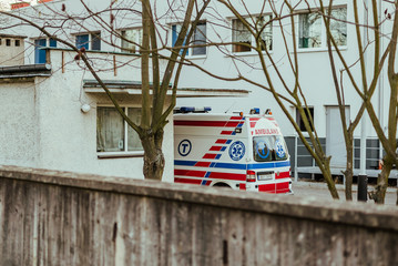 Parked ambulance vehicle in front of hospital building