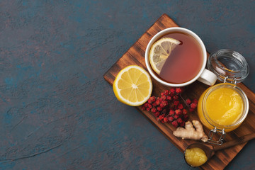Vitamin tea recipe. Natural ingredients on a woodan plate. Flat lay, top view, copy space.