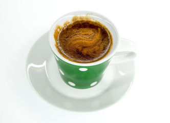 green coffee mug with hot instant coffee foam