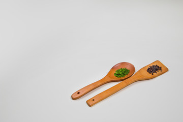 Wooden spoons with some herbs and food spices