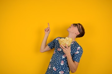 man with popcorn in his hands