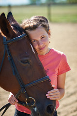 Obraz premium girl getting ready to ride a horse